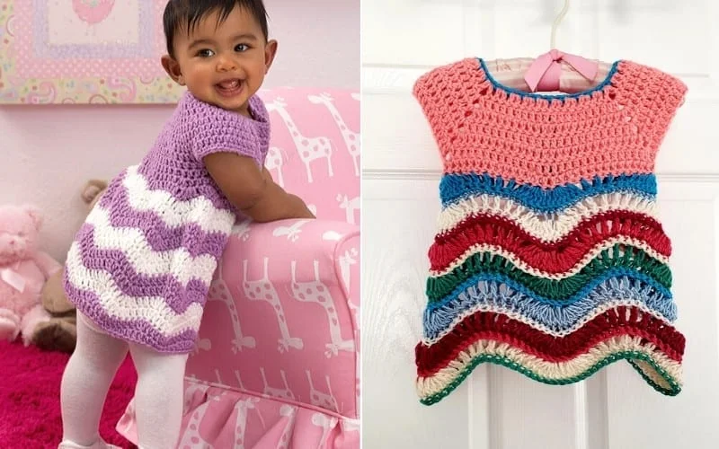 A baby wearing a purple and white crochet dress stands smiling next to a pink patterned chair. On the right, a multicolored knitted dress is displayed on a hanger.