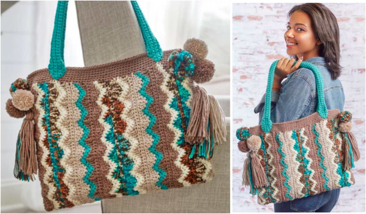 A woman holds a Flame Stitch Bag with wavy patterns in teal, brown, and cream. The bag features teal handles, pom-poms, and tassels, showcasing an intricate crochet pattern.