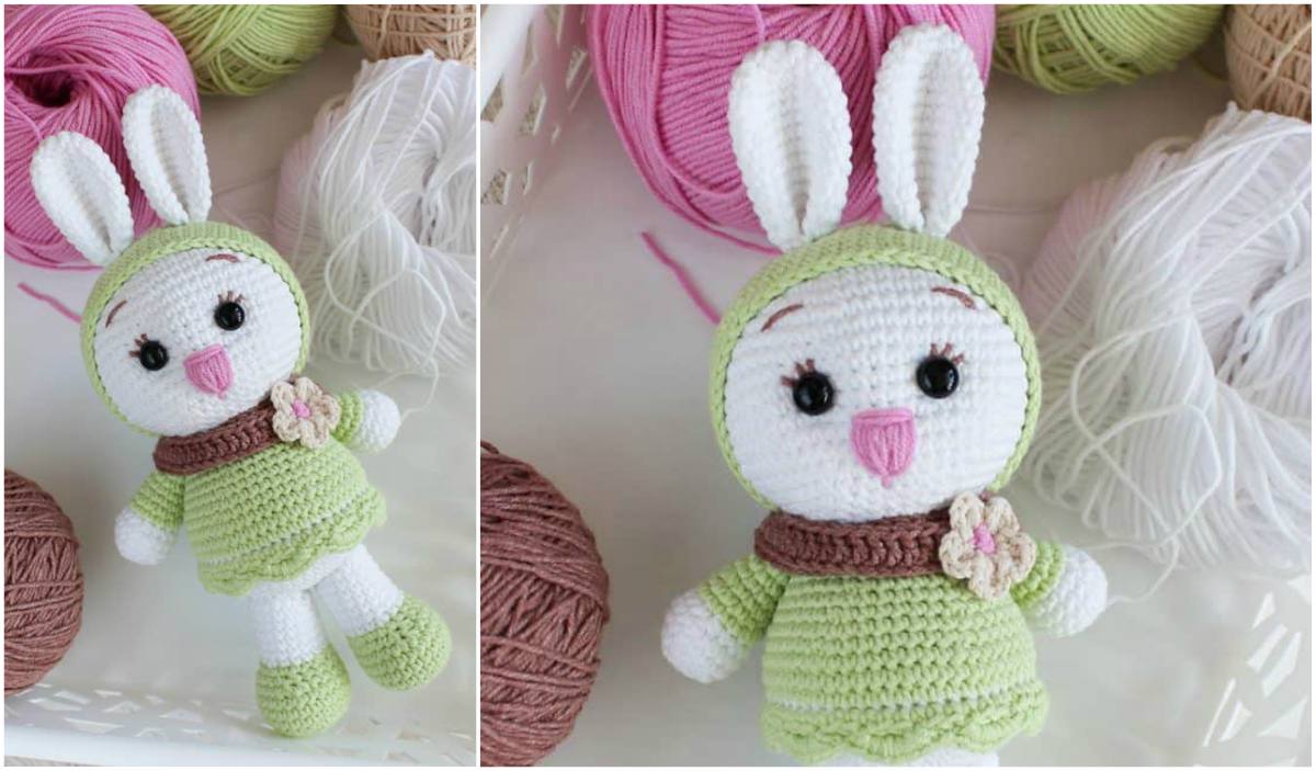 The Sunny Bunny crocheted doll, dressed in a green outfit with a brown scarf and flower, is surrounded by vibrant balls of yarn in pink, green, white, and brown. Perfect for adding charm to your collection.