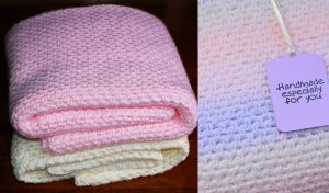 A stack of folded, handmade knitted blankets in shades of pink, cream, and pastel rainbow lies with a tag reading "Handmade especially for you." Perfect as a fast and easy crochet baby blanket, each piece wraps your little one in warmth and love.