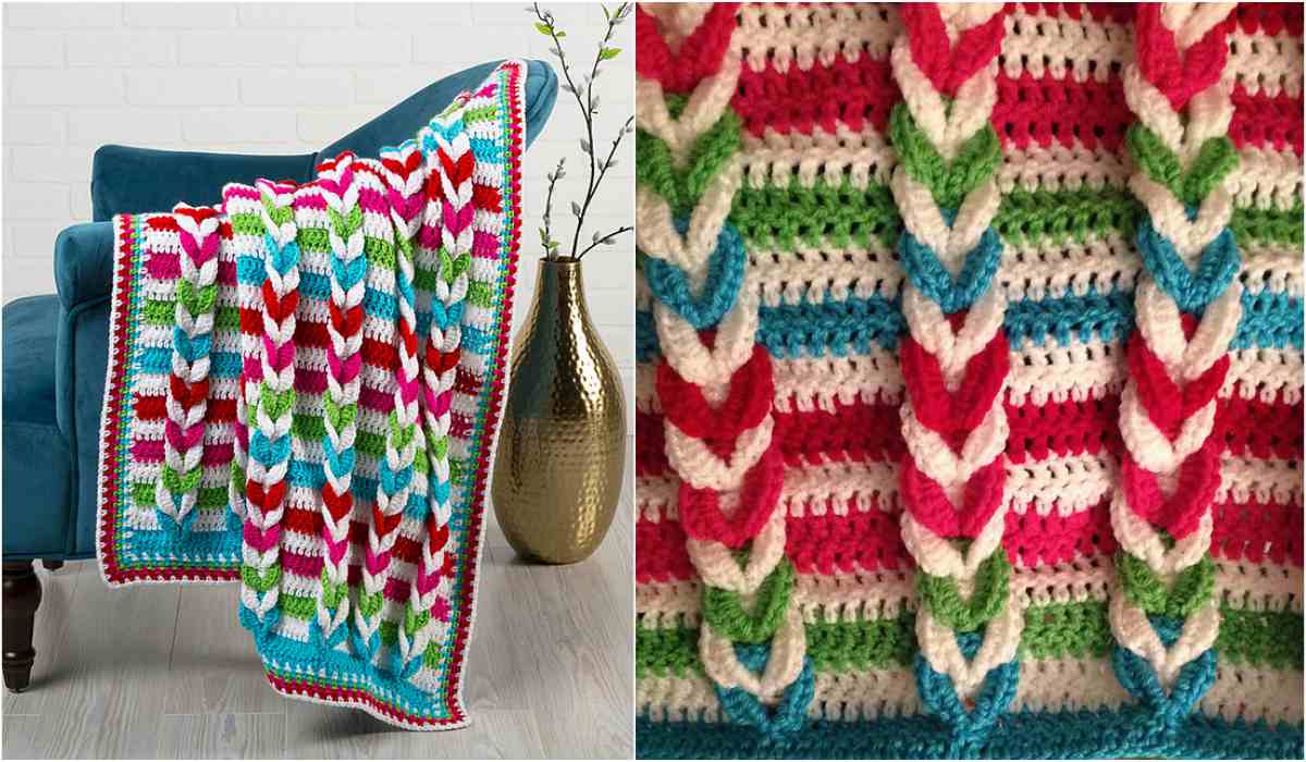 A colorful crochet blanket featuring a braided pattern, styled as the Pulled Taffy Baby Blanket, is draped over a turquoise chair beside a large gold vase. Close-up reveals red, green, blue, and white braided stitches. Find your free crochet pattern to create this vibrant piece yourself.