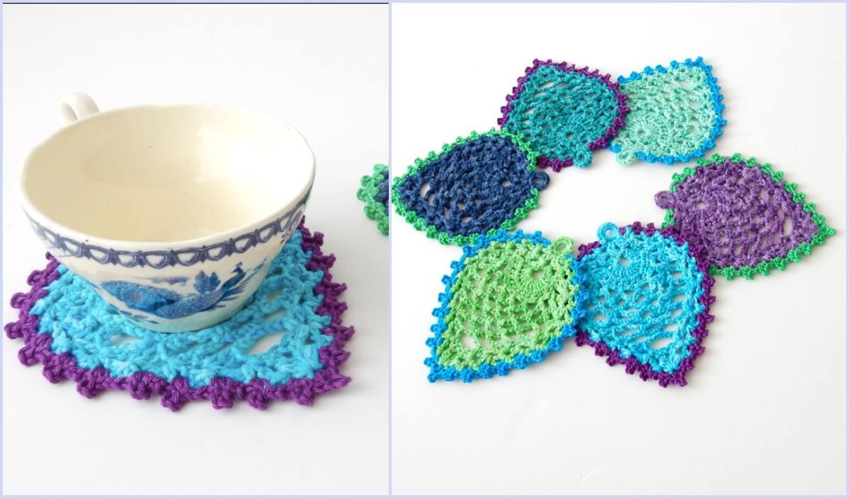 A teacup sits elegantly on a blue and purple crocheted coaster, accompanied by a vibrant set of leaf-shaped crochet coasters arranged in a circle, featuring peacock-style details for a stunning touch.