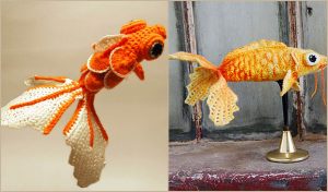 Two crocheted goldfish, one suspended mid-air and the other mounted on a stand, showcase intricate stitching and vibrant orange and white colors. Perfect for those inspired by a free crochet pattern to add unique pieces to their creations.