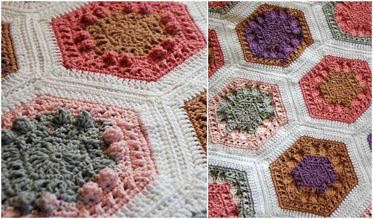 Close-up of a crocheted blanket with hexagonal patches in various colors, including pink, gray, purple, and brown. This beautiful design draws inspiration from a hexagon quilt and is set against a white background.