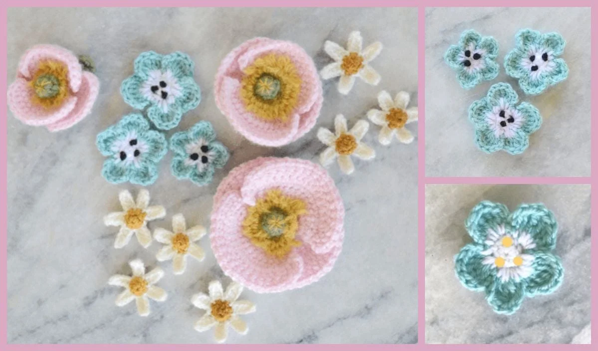 Crocheted dogwood flowers in various shapes and colors, including pink, yellow, blue, and white, are elegantly displayed against a light background.