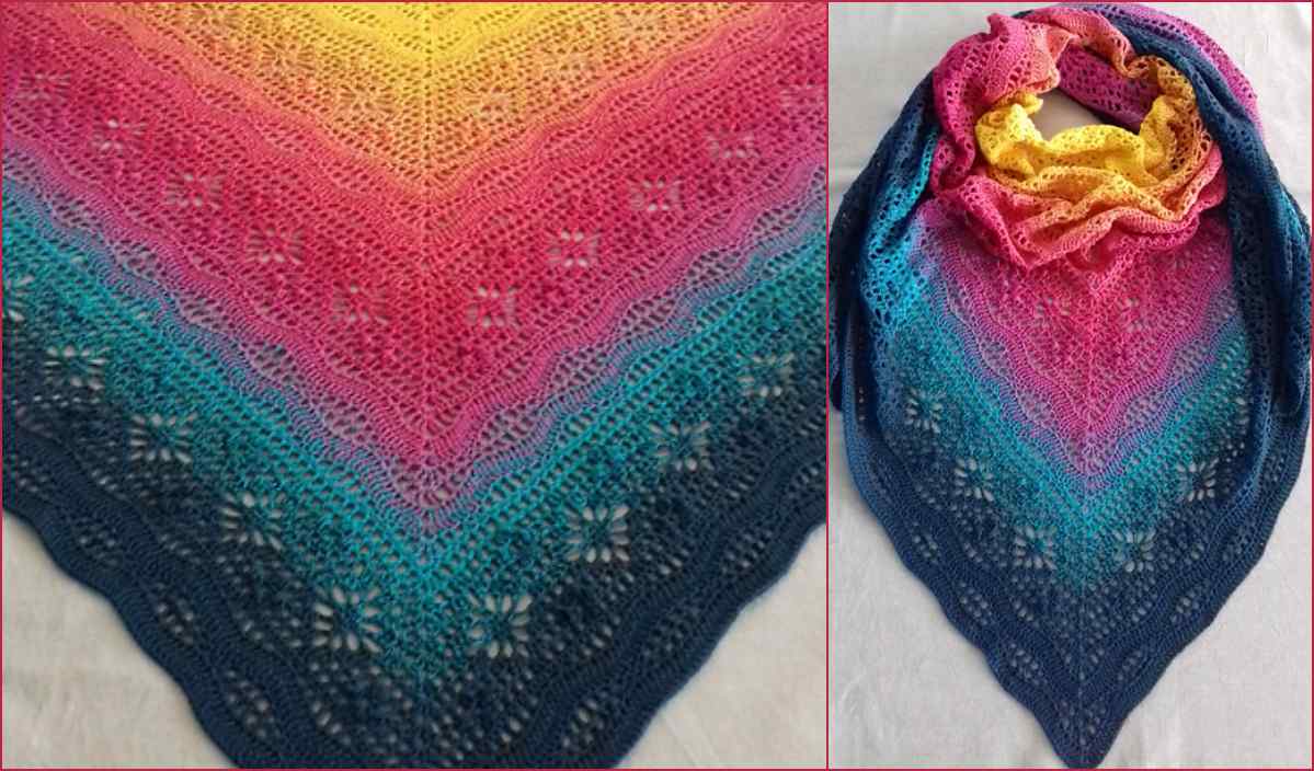 The Daisy Chain Shawl is a colorful knitted masterpiece, showcasing a gradient from yellow to dark blue with an intricate lace pattern. It’s artfully folded in a triangle and draped in a circle, offering inspiration for your next project.