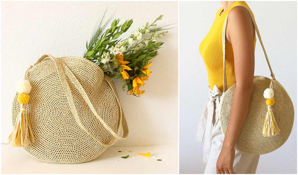 Round straw bag with a tassel and flowers inside, beautifully crafted with a Sun City crochet pattern, shown on a table and on a person wearing a yellow top and white pants.