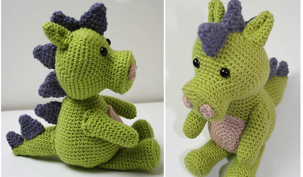 A crocheted green dragon toy, featuring purple spikes and black eyes, is displayed from two different angles.