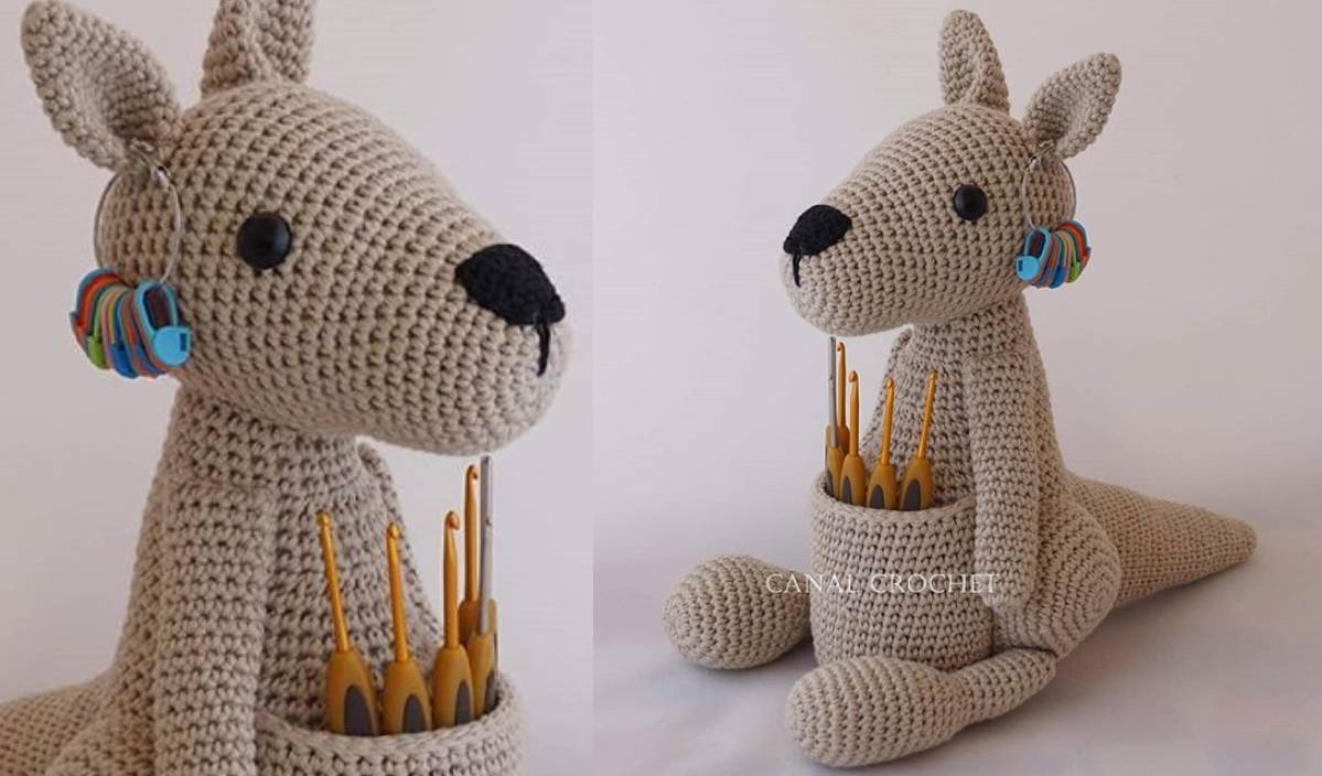 This charming crocheted kangaroo hook holder cradles your crochet hooks in its pouch, while colorful stitch markers adorn its ear. Perfect for crafters, the delightful design can be made using a crochet pattern featuring an easy-to-follow video tutorial.