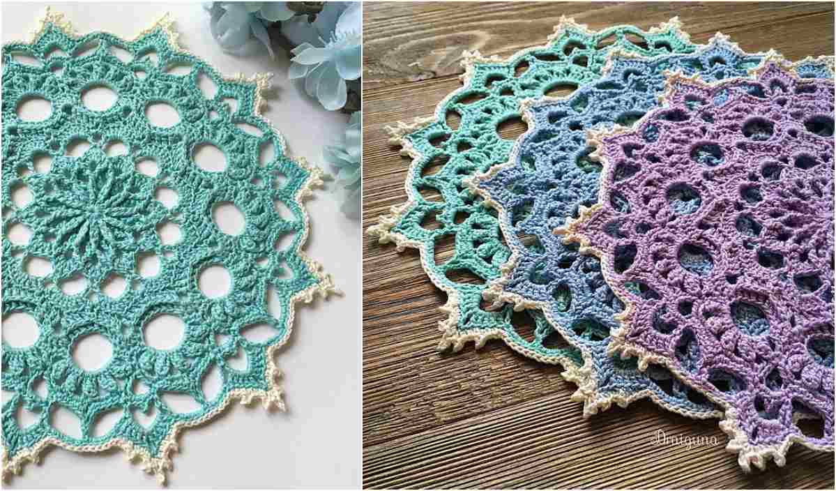 Displayed on a wooden surface, the Wispweave Doily showcases crochet artistry in shades of green, blue, and purple.