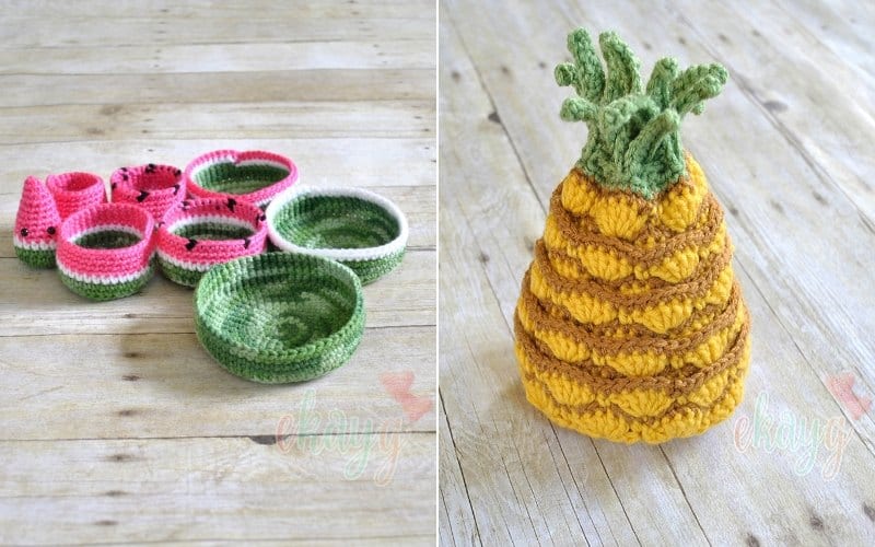 Neat crocheted fruit-themed baskets, resembling watermelon slices and a pineapple, rest beautifully on the wooden surface. Discover free patterns to craft these charming nesting bowls for an organized touch.