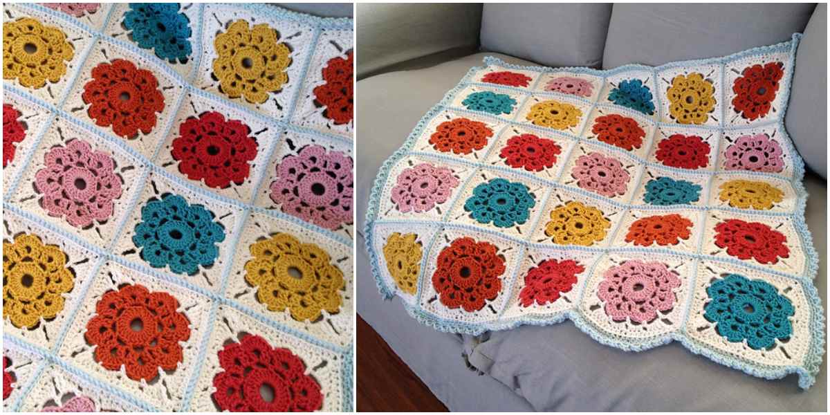 Crochet blanket with floral square patterns in red, yellow, orange, and pink on a gray sofa, inspired by a free crochet pattern.