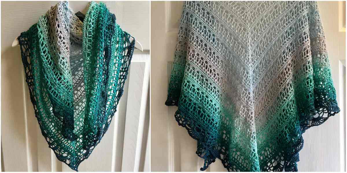 A crocheted shawl, or "Schal," showcases a delicate crochet pattern with a gradient from dark green to light gray, reminiscent of the Quiraing's earthy tones, artfully draped over a door.