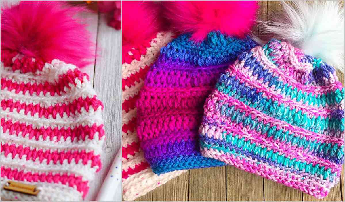 Three colorful knitted hats with pom-poms, reminiscent of a penguin's playful style, are displayed on a wooden surface. Each hat features striped patterns in varying colors, offering inspiration for your next crochet pattern adventure.