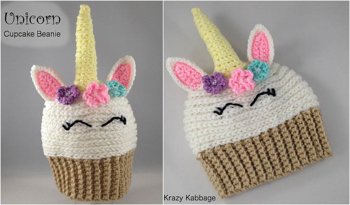 Crocheted unicorn cupcake beanie featuring pink and purple flowers, a yellow horn, and closed eyes on a white top with a brown ribbed base. Inspired by the Love Bug Slouchy Hat, this adorable piece is as whimsical as it is warm.