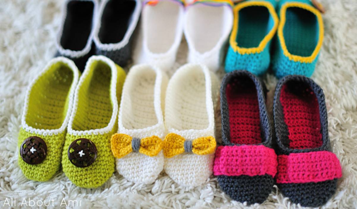 A variety of colorful crocheted baby slippers displayed on a soft surface, perfect for those seeking a free crochet pattern.