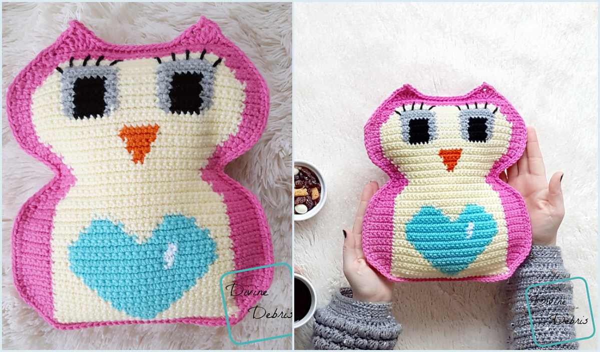 Crocheted owl pillow with a heart on its chest, featuring pink edges, large eyes, and an orange beak. Hands holding this charming creation on the right. A delightful crochet pattern for those inspired by whimsical designs.