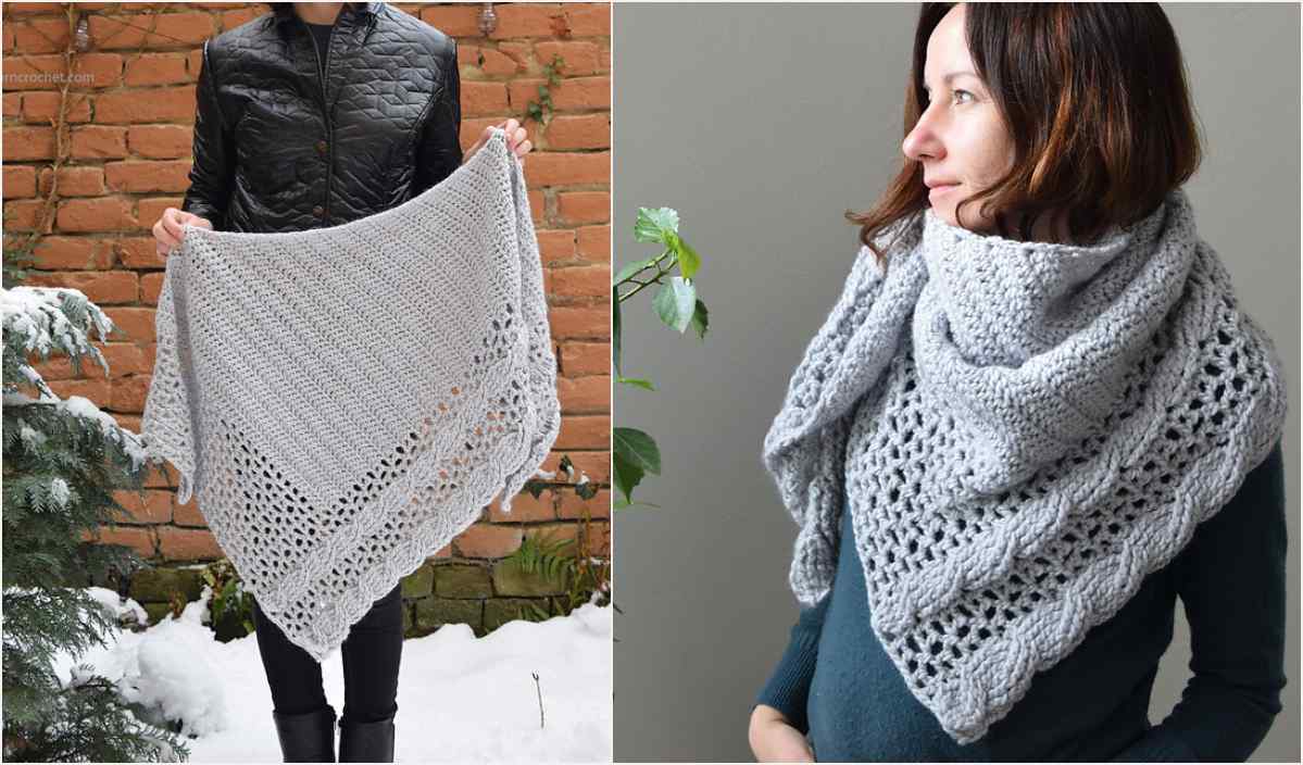 A person holds and models a knitted gray triangular shawl with a textured pattern, reminiscent of a cozy crochet design.