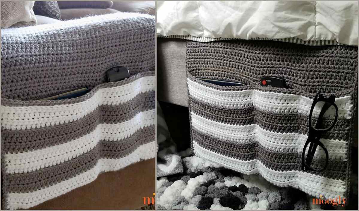 Two crochet couch arm covers with pockets, serving as a cozy couch organizer, hold a remote control and glasses. Designed in gray and white stripes, they drape stylishly over the armrest.