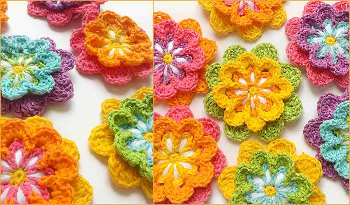 Colorful crocheted flowers made from yarn in shades of pink, yellow, orange, green, blue, and purple are artfully arranged on a white background, reminiscent of the vibrant designs found in a Marina Shawl crochet pattern.