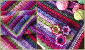 Colorful crocheted blanket with stripes and floral patterns, reminiscent of Waldo's Puzzle Afghan, alongside balls of yarn in various bright colors.