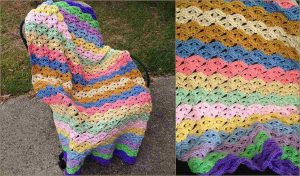 A multi-colored crochet blanket with an Irish Wave pattern is draped elegantly over a chair; a close-up reveals the intricate stitch details of this captivating design.