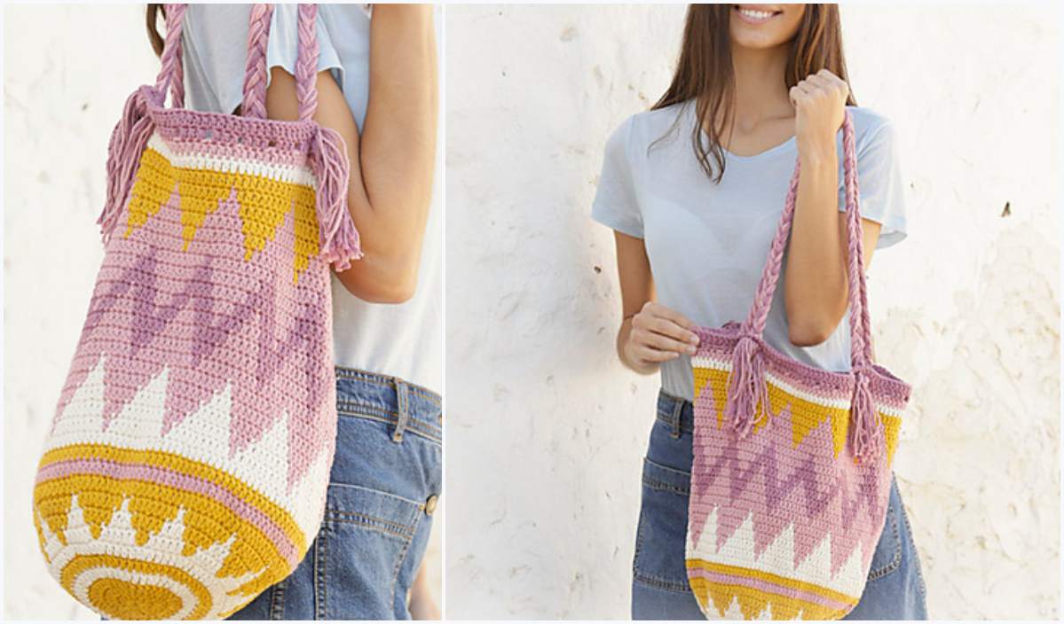 A woman holds a crochet bag with pink, purple, and yellow geometric patterns, reminiscent of a charming bunny basket, against a white background.