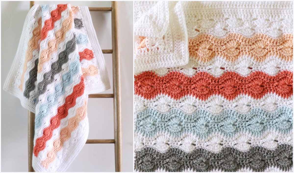 Catherine's Stitch crochet baby blanket with wavy stripes in white, orange, blue, and gray draped over a wooden ladder, showcasing a close-up of the intricate pattern on the right.