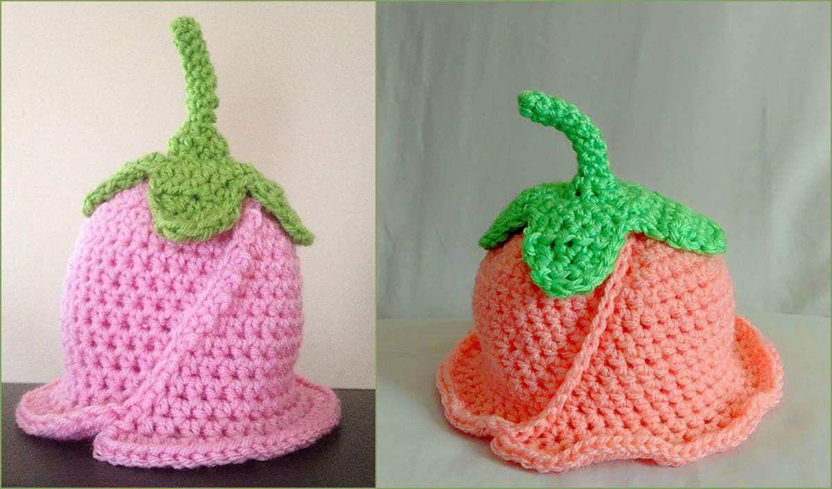 A charming crochet pattern brings to life two fruit-inspired hats: one pink with a green top echoing a berry, and the other an orange hue with a leafy crown resembling a peach. Perfectly suited for newborns, these vibrant accessories add a playful touch to any little one's wardrobe.