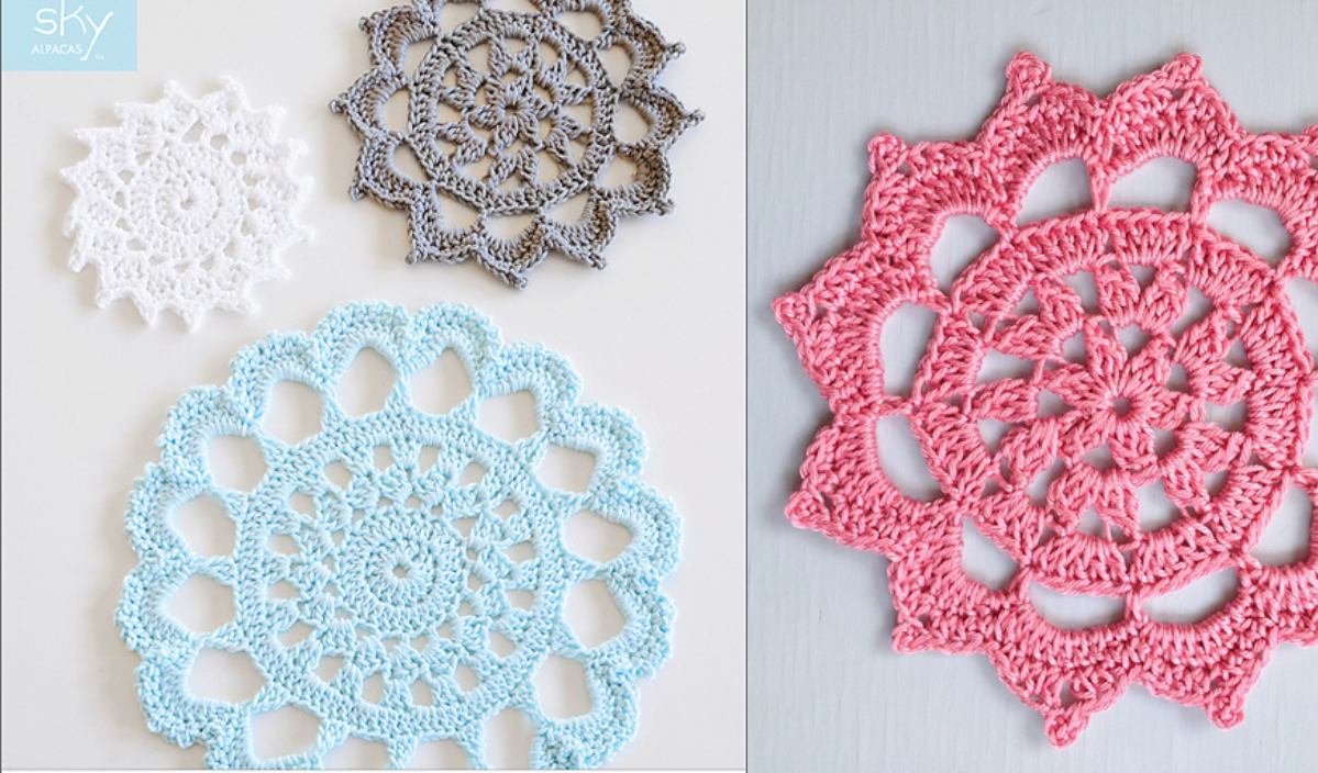 Crochet doilies in white, gray, and blue serve as elegant coasters on the left, with a pink doily triveting on the right. All boast intricate patterns across a light surface.