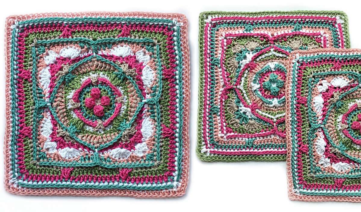 These two colorful crochet squares, titled "Flying Colors," showcase intricate patterns with green, pink, white, and peach yarn set against a white background. Inspired by a free crochet pattern, they embody the perfect blend of creativity and craftsmanship.