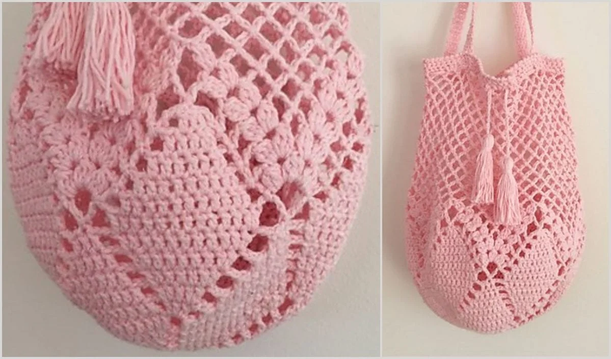 Introducing the Hummingbird Bag: a pink crochet tote adorned with a diamond pattern and tassels. Shown in close-up and full view against a light background, this charming accessory is perfect for any occasion. Ideal for those who cherish handmade elegance and appreciate free crochet patterns.