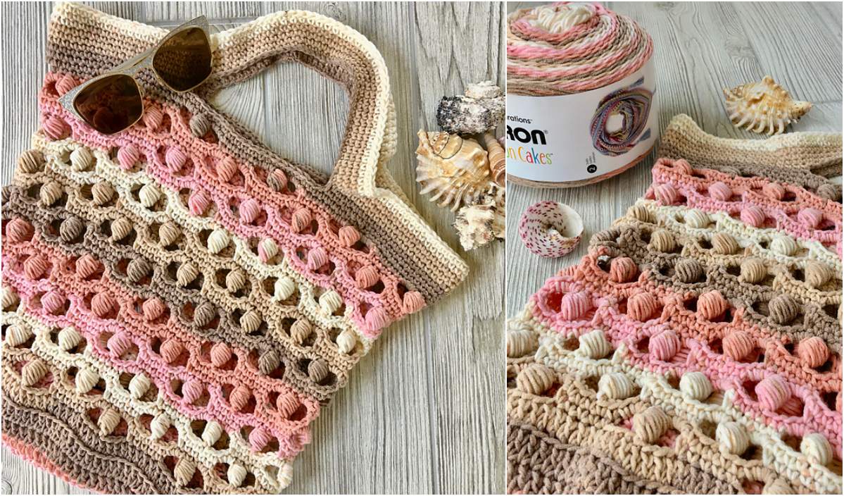 Crocheted tote bag with earth-toned stripes and shell stitch pattern, reminiscent of a peaceful sea shore. Sunglasses rest on top while yarn and seashells lie nearby on a light wooden surface.