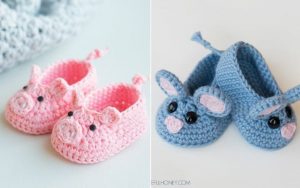 A pair of crocheted baby shoes with a pig on them.