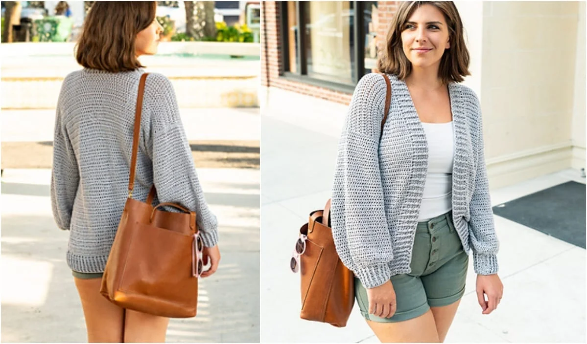 A person in a light gray cotton cardigan and green shorts stands outdoors, showcasing a chic yet casual look. They carry a brown leather bag over their shoulder, effortlessly blending style with functionality.