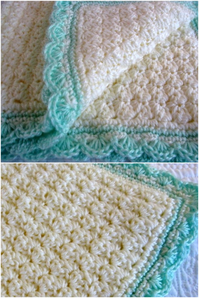A close-up of a crocheted blanket with a textured cream pattern and a scalloped green and blue crochet blanket edging, shown folded and laid flat.
