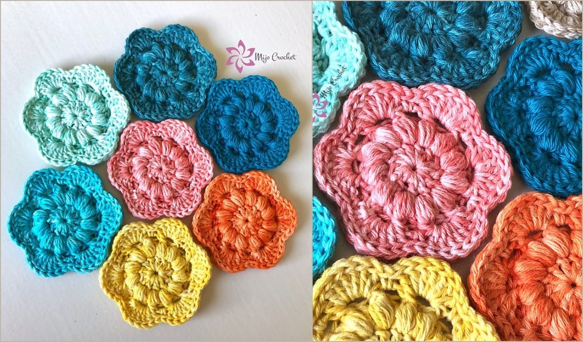 Crocheted flowers in vibrant hues of pink, blue, yellow, and orange beautifully displayed on a surface, reminiscent of the Miarly CAL Blanket.