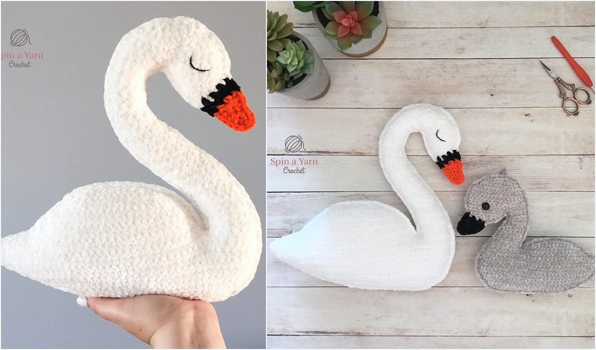 A hand holds a crocheted white swan on the left; nearby, a similar swan and a smaller gray one rest on a wooden surface, accompanied by scissors and a plant. This charming swan amigurumi scene is perfect for those following a free crochet pattern.