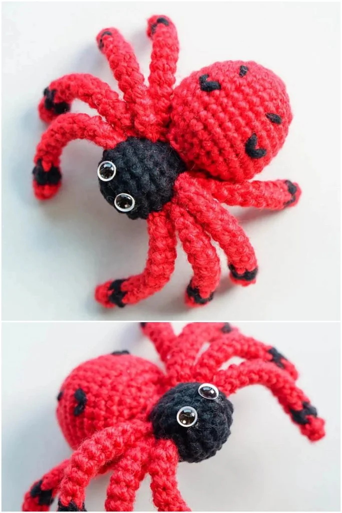 A crocheted spider toy for Halloween decor, featuring a black head and a red body with black spots and legs.