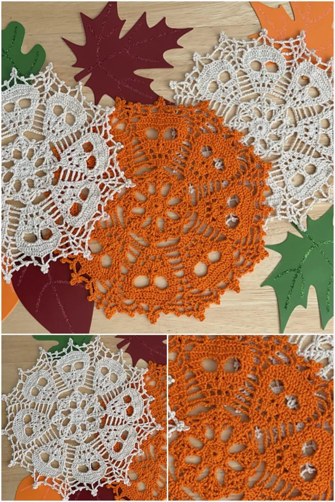 Three crochet skull-patterned doilies arranged with paper leaves on a wooden surface, perfect for Halloween decor.