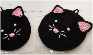 A black cat crochet piece with pink ears, a pink nose, and white whiskers captures feline charm. Ideal for those exploring free crochet patterns or wishing to add whimsical touches to their collection.