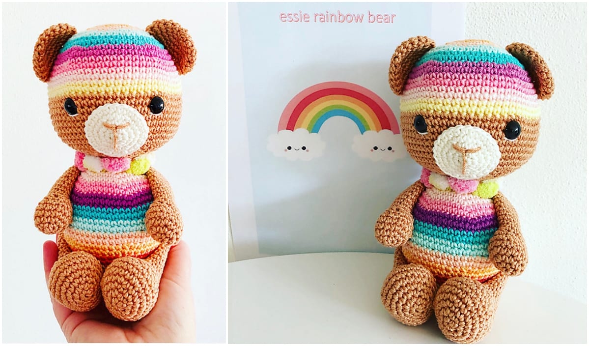 A handmade crochet bear with rainbow-colored stripes sits next to a poster showing a rainbow with clouds, labeled "essie rainbow bear." Explore free patterns to create your own vibrant bears and add a splash of color to any room.