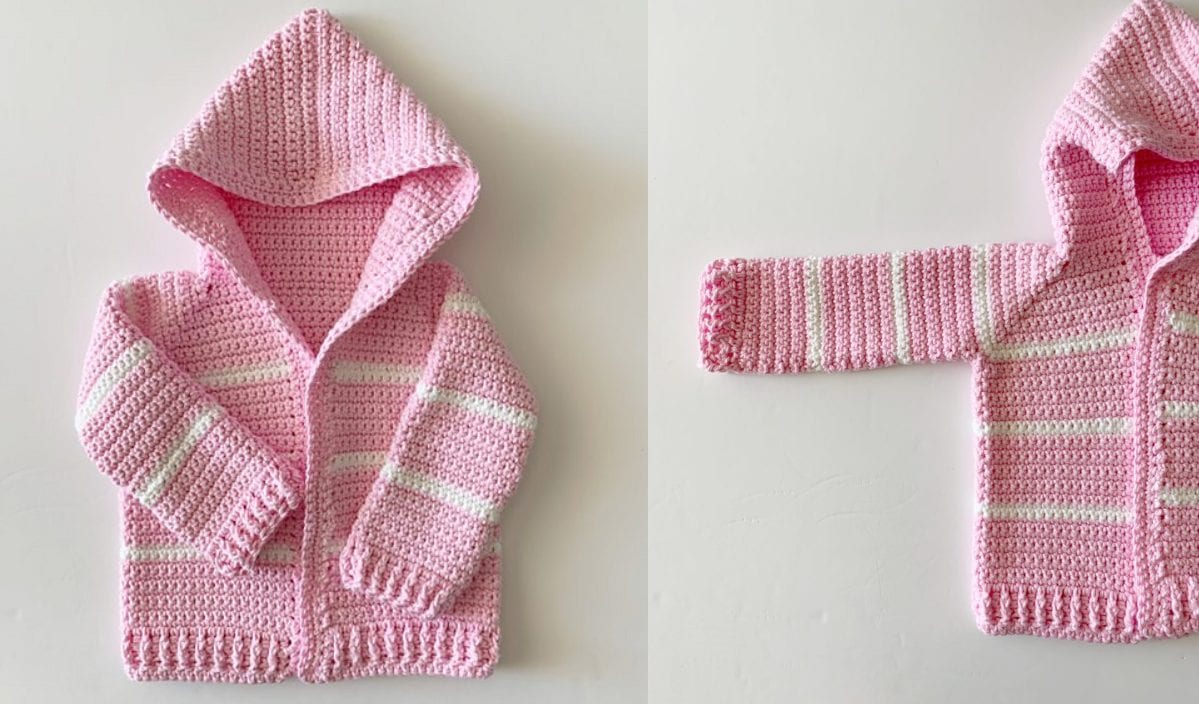 Pink crocheted toddler hoodie with white stripes, shown with the hood up and one sleeve extended. Perfect for chilly days, it complements Free Crochet Patterns you might explore for a cozy wardrobe.