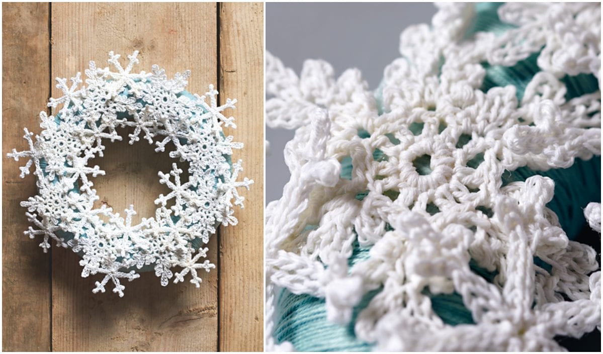 A close-up view of a white crocheted snowflake winter wreath on a wooden surface, with a detailed zoom showing intricate crochet patterns against teal threads.