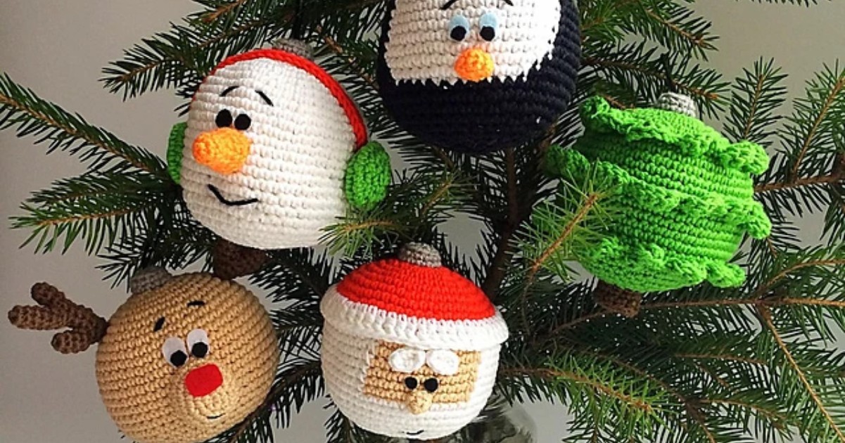 Crocheted Christmas tree ornaments, featuring a snowman, penguin, tree, reindeer, and Santa, hang charmingly on a branch.