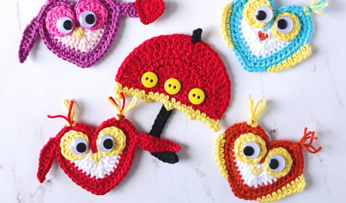 Colorful crocheted owl and heart designs, inspired by free crochet patterns, surrounding a red umbrella with buttons on a white background.