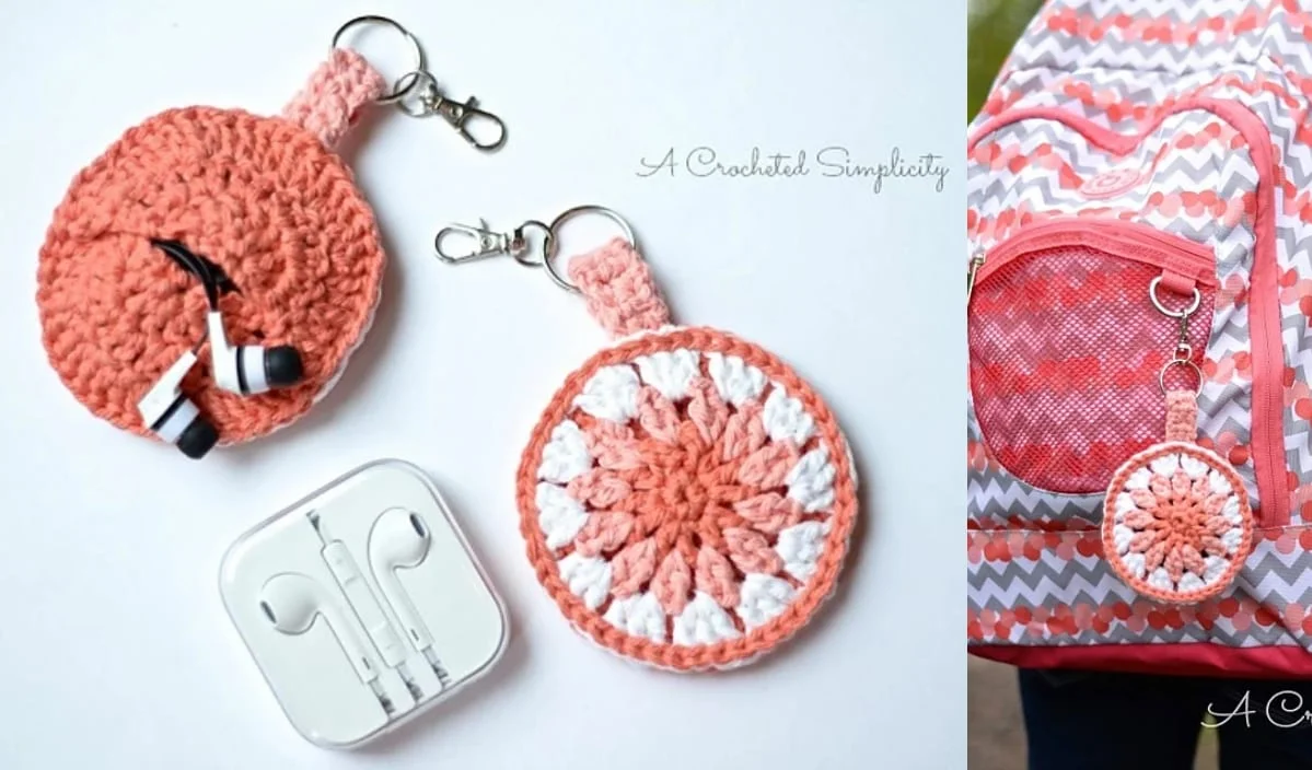 This crocheted round pouch keychain, designed with intricate crochet patterns, neatly holds your earphones. It's shown stylishly next to a backpack and an earphones case, making it the perfect earbud holder for on-the-go convenience.