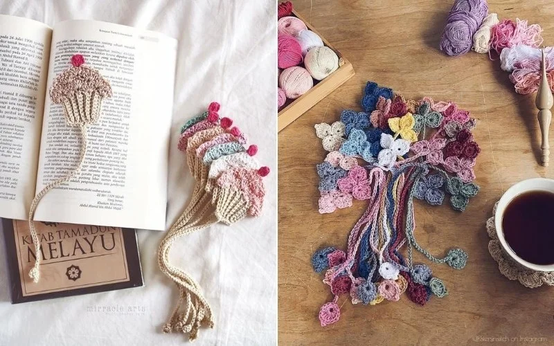 Crochet bookmarks, intricately shaped like cupcakes and flowers, rest charmingly upon an open book. Nearby, a cozy scene unfolds with skeins of yarn and a steaming cup of tea on the table.