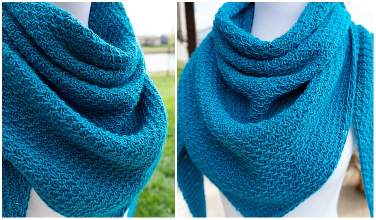 Close-up of a blue crochet triangle shawl draped on a mannequin, showcasing its textured pattern.