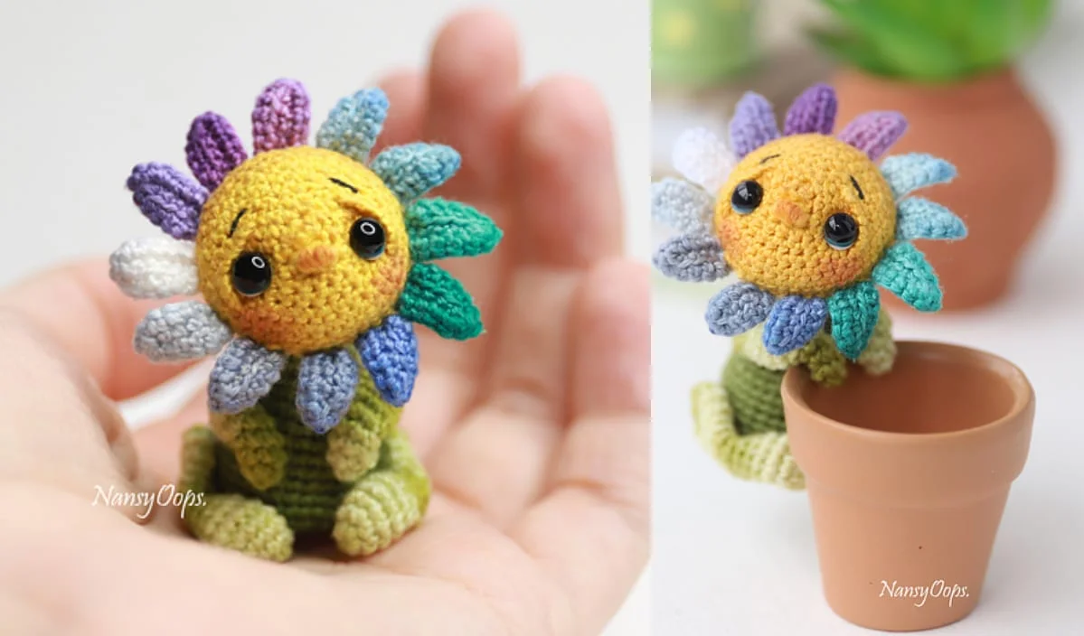 A blossoming project of creativity, this crocheted sunflower creature features colorful petals, black eyes, and green limbs. It sits effortlessly in a hand and a small clay pot, perfect for those who relish free crochet patterns.